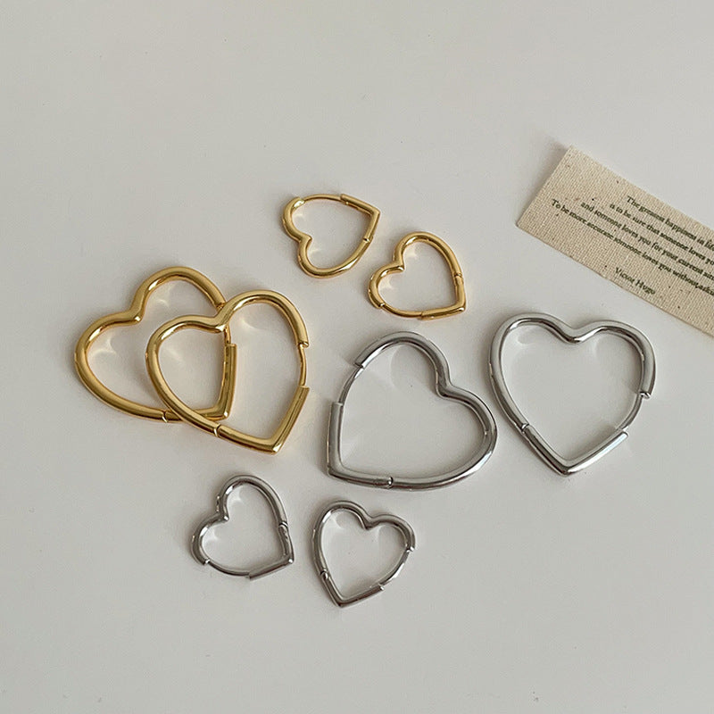 Örhängen i form av ett hjärta för kvinna